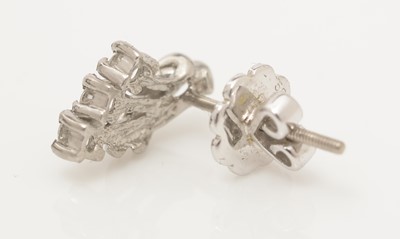 Lot 304 - Pair of diamond earrings.