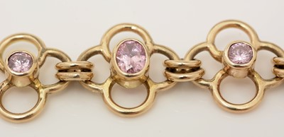 Lot 308 - A 9ct yellow gold and pink stone bracelet