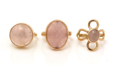 Lot 334 - Three rose quartz rings.
