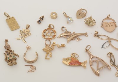 Lot 342 - A selection of 9ct yellow gold and yellow metal charms and pendants