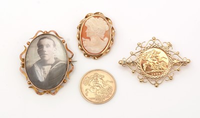 Lot 390 - Three brooches and a medallion.