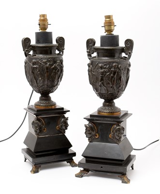 Lot 1017 - A pair of patinated bronze and slate table lamps