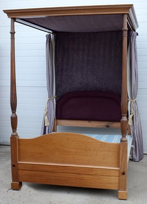 Lot 1078 - A Regency-style mahogany four-poster bed.