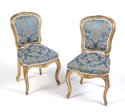 Lot 1087 - Two Georgian gold painted salon chairs