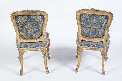 Lot 1087 - Two Georgian gold painted salon chairs