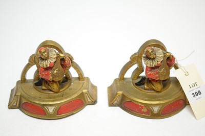 Lot 398 - A pair of Art Deco brass enamelled bookends