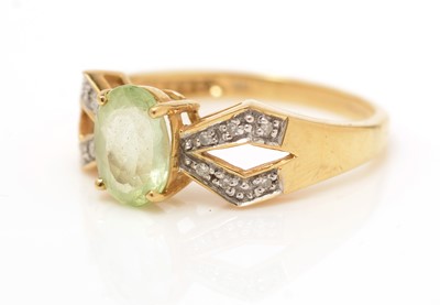 Lot 244 - A peridot and diamond ring, and a green apatite and diamond ring