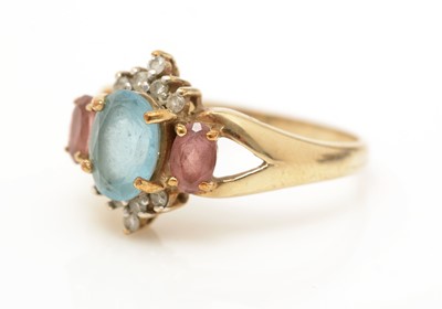 Lot 48 - A topaz, pink-stone and diamond ring