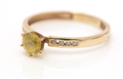 Lot 60 - A yellow zircon and diamond ring