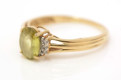 Lot 61 - A yellow zircon and diamond ring