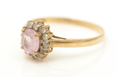 Lot 74 - A pink sapphire and diamond ring