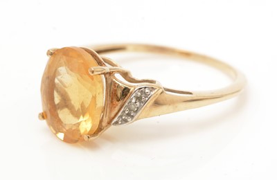 Lot 78 - A citrine and diamond ring