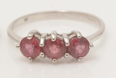 Lot 102 - Five ruby and white stone rings