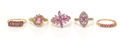 Lot 103 - Five ruby and white stone rings