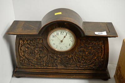 Lot 354 - An oak mantel clock, retailed by Liberty & Co.