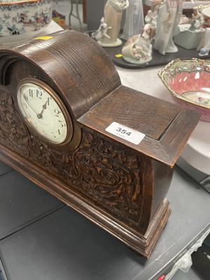 Lot 354 - An oak mantel clock, retailed by Liberty & Co.
