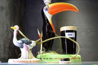 Lot 404 - A Carlton Ware Guinness toucan ceramic table lamp and another.