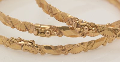 Lot 136 - A set of three Chinese gold bangles