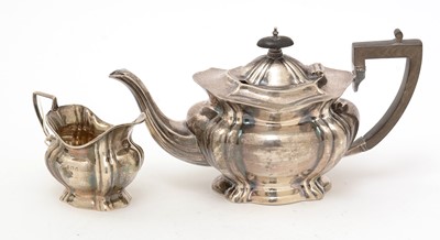 Lot 405 - A silver teapot and milk jug