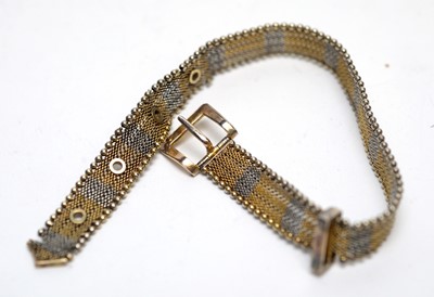 Lot 133 - A yellow and white metal mesh pattern bracelet.