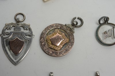 Lot 127 - A selection of silver and white metal fobs