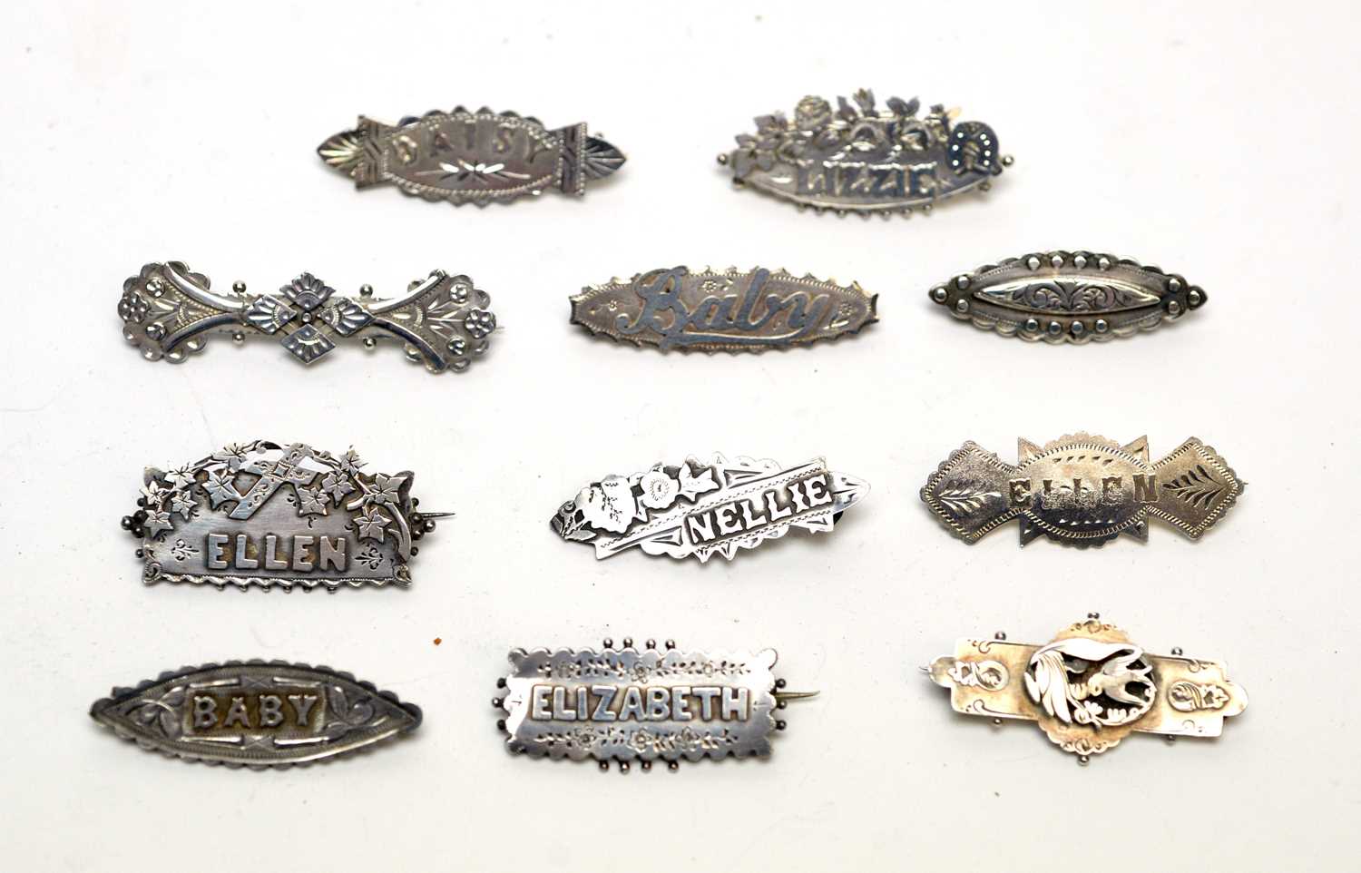 Lot 135 - A collection of silver Victorian and early 20th Century brooches
