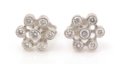 Lot 430 - A pair of diamond earrings
