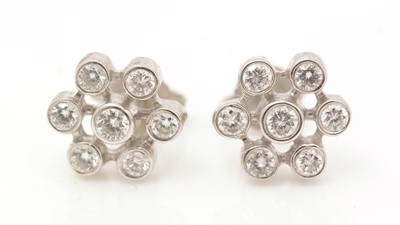 Lot 430 - A pair of diamond earrings