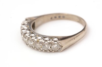 Lot 431 - A diamond half hoop eternity ring