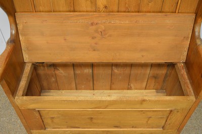 Lot 7 - A stained pine hall settle.