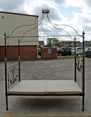 Lot 18 - An ornate wrought metal four poster bed