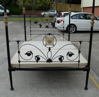 Lot 18 - An ornate wrought metal four poster bed