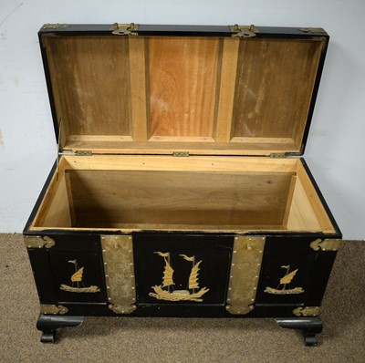 Lot 16 - A Chinese brass bound lacquered camphorwood blanket chest