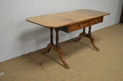 Lot 36 - A Regency mahogany and brass inlaid sofa table.