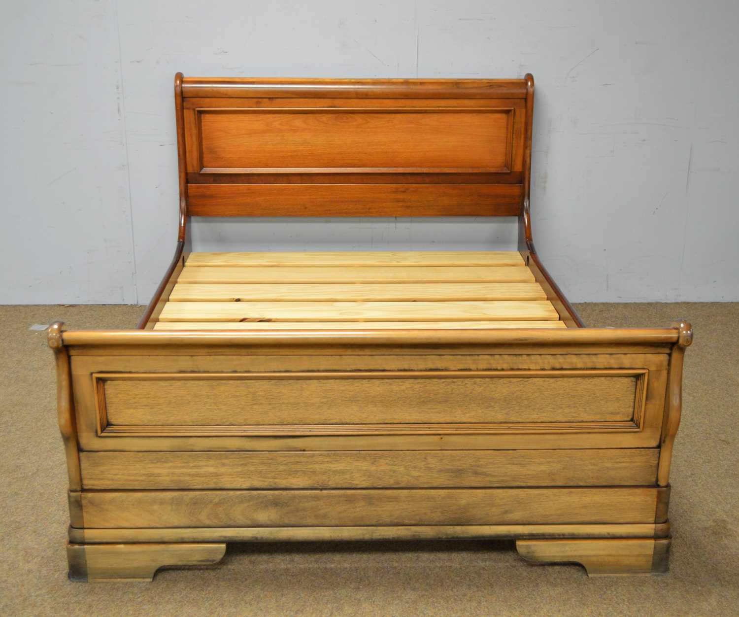 Lot 20 - Willis & Gambier: a Louis Philippe-style cherrywood sleigh bed.