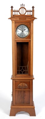 Lot 992 - An early 20th C German Jugendstil walnut longcase clock.