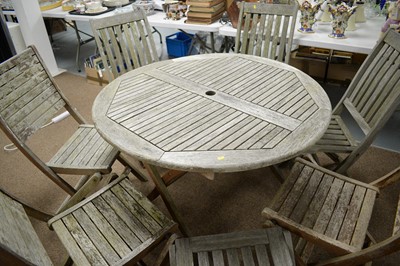 Lot 80 - Circular teak garden table; and seven garden chairs, various.