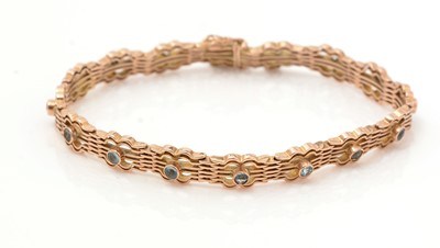 Lot 449 - An early 20th Century yellow metal and aquamarine bracelet