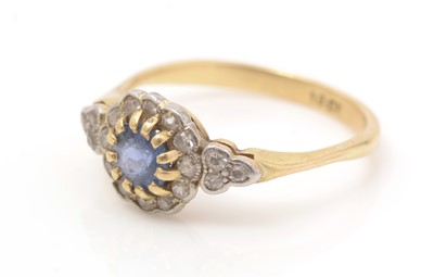 Lot 453 - A diamond and sapphire cluster ring