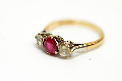 Lot 203 - An amber and diamond dress ring, and four others