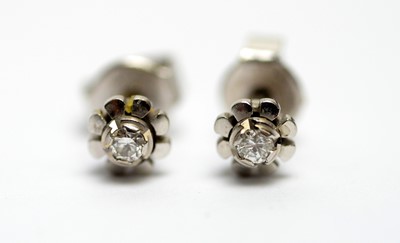Lot 274 - A pair of 18ct white gold and diamond stud earrings