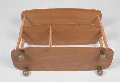 Lot 371 - Ercol; an elm and beech trolley bookcase, No 361.
