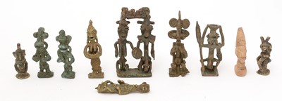 Lot 667 - A collection of Onile figures and Edan Ogboni staff/rod pommels