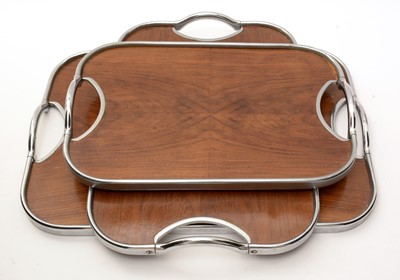 Lot 447 - A graduated set of three Art Deco two-handled trays.