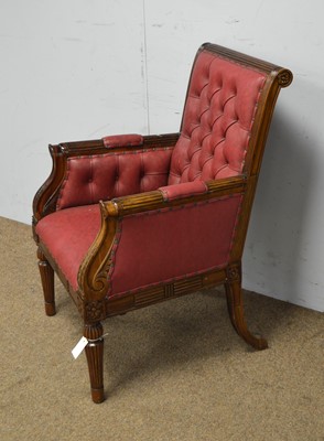Lot 15 - A leaf carved and fluted Georgian-style buttoned-back armchair.