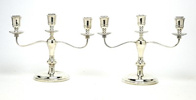 Lot 539 - A pair of Elizabeth II silver twin branch candelabra, by Charles S Green & Co L