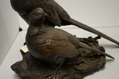 Lot 457 - A bronzed resin sculpture of a pair of pheasants.