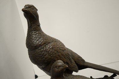 Lot 457 - A bronzed resin sculpture of a pair of pheasants.