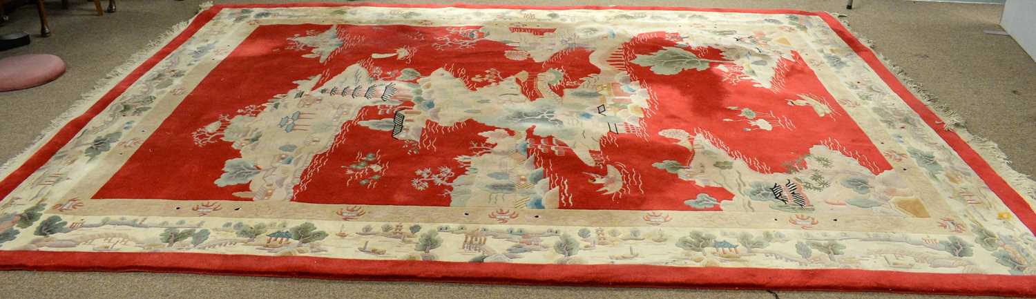 Lot 117 - A 20th Century Chinese washed-wool carpet.