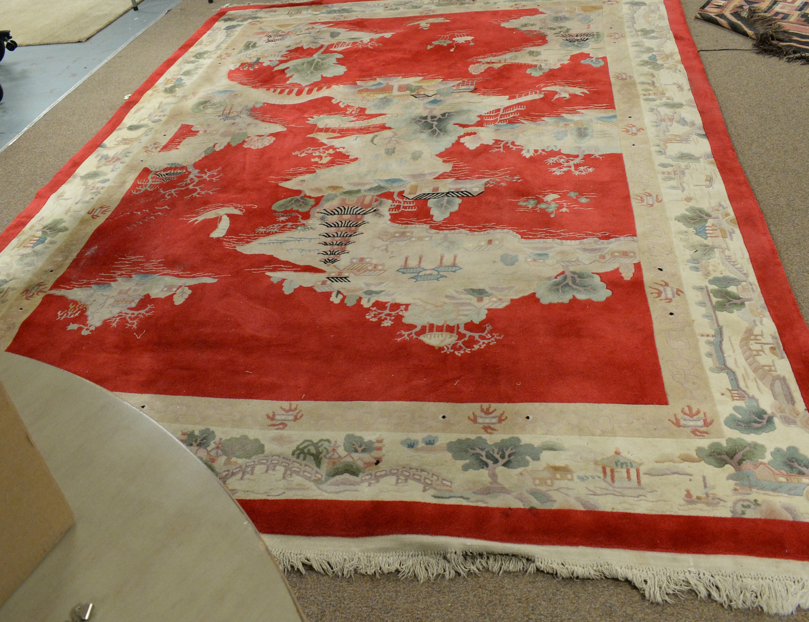 Lot 117 A 20th Century Chinese washedwool carpet.